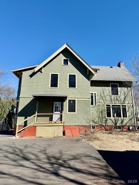 view of front of property featuring a chimney