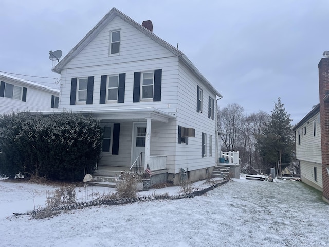 view of front of home with a chimney