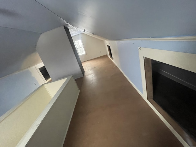 corridor with lofted ceiling