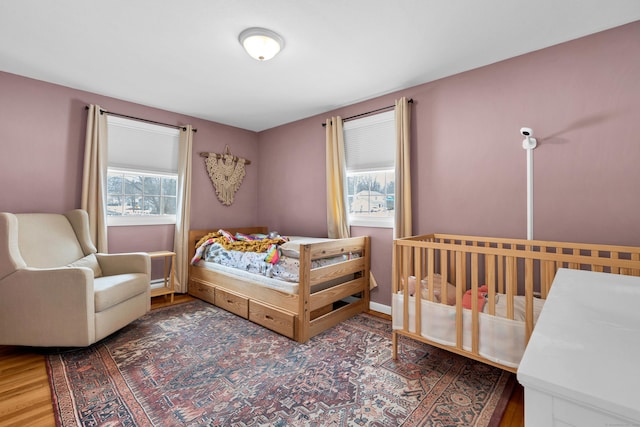 bedroom featuring wood finished floors