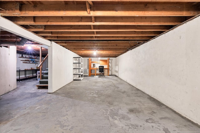 unfinished basement with stairway