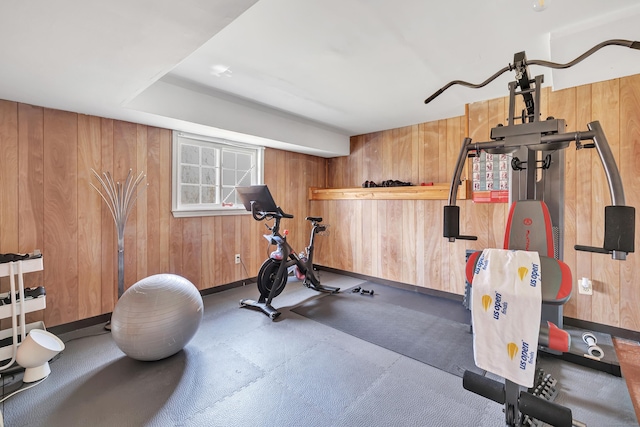 exercise area featuring wooden walls