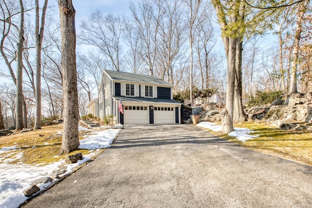 view of front of home featuring driveway and a garage