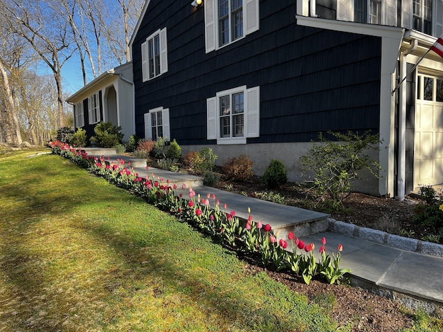 view of property exterior with a yard