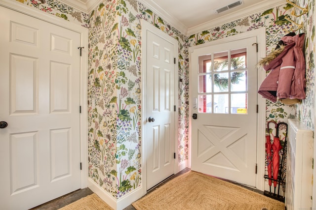 doorway to outside with wallpapered walls, baseboards, visible vents, and ornamental molding