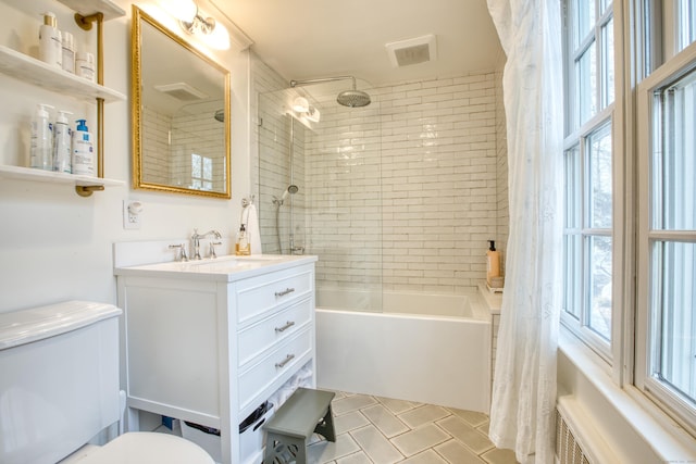 full bathroom with radiator, visible vents, shower / bathtub combination with curtain, toilet, and vanity