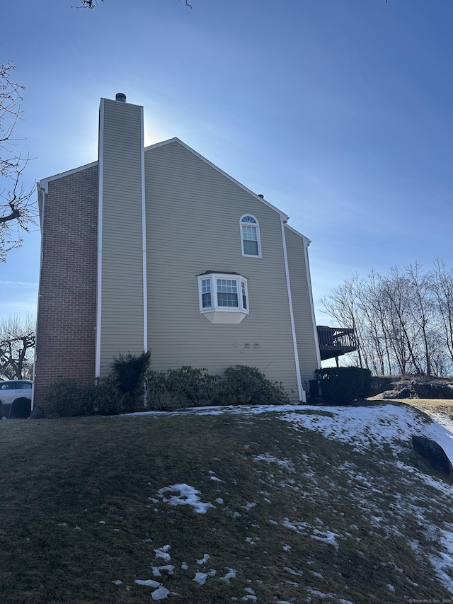 view of side of property with a chimney