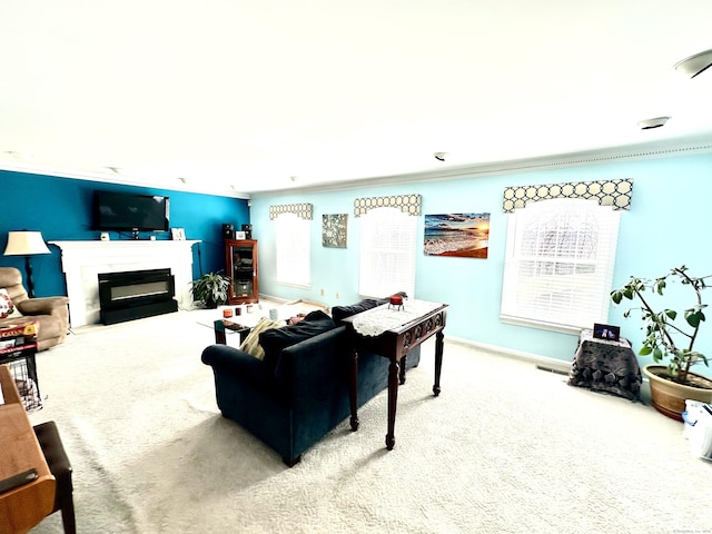 living room featuring a fireplace with flush hearth, carpet, and baseboards