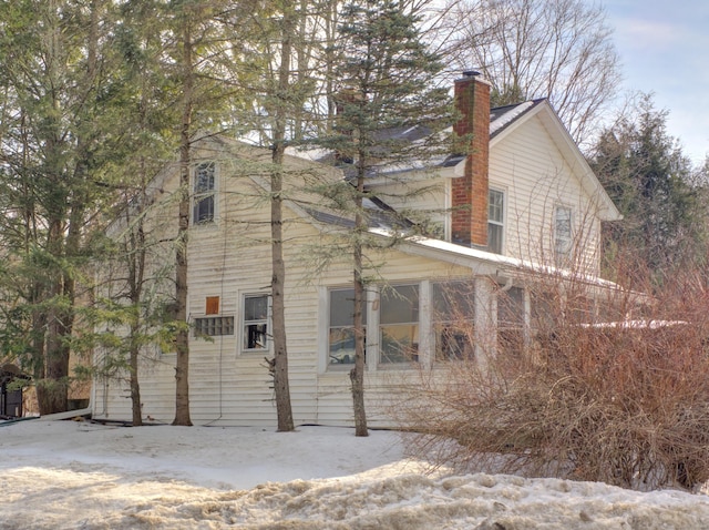 view of home's exterior featuring a chimney