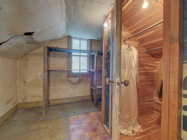 bathroom featuring lofted ceiling