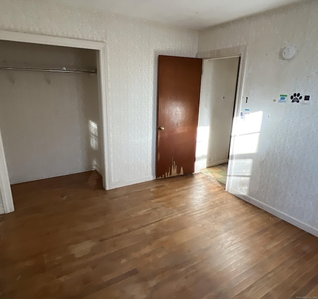 280 Merrow Rd, Tolland, CT 06084 - unfurnished bedroom with a closet and wood finished floors
