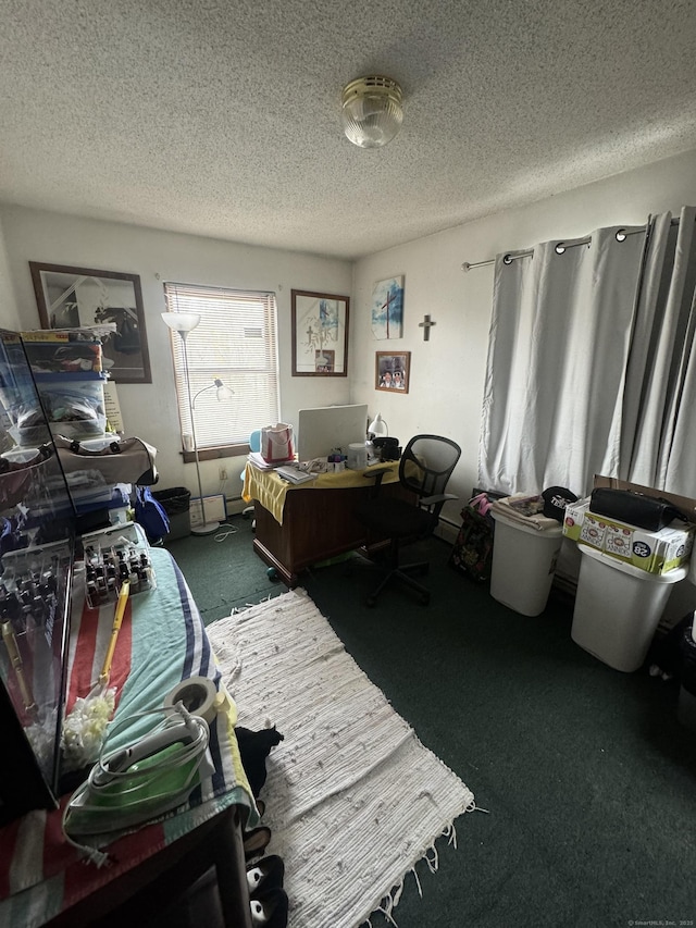 home office with a textured ceiling and dark colored carpet