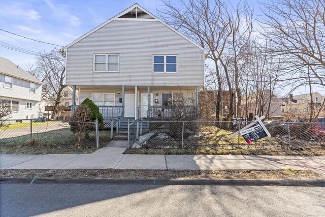 33 Guilford St Unit B, Hartford, CT 06120 - colonial-style house featuring covered porch and a fenced front yard
