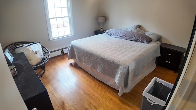 bedroom with wood finished floors