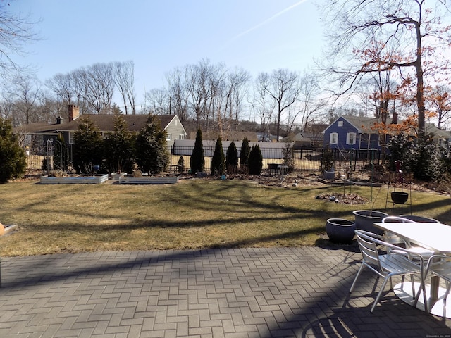 exterior space featuring a patio, a yard, and fence