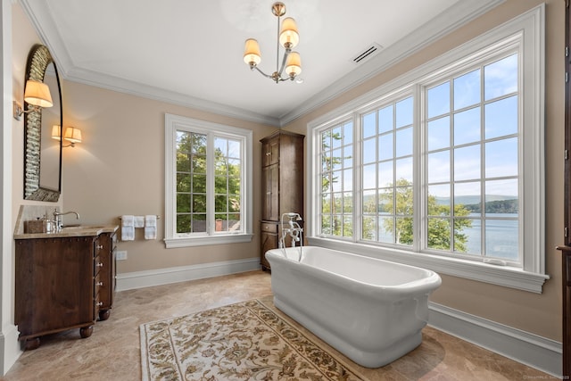 full bathroom featuring visible vents, ornamental molding, an inviting chandelier, a freestanding bath, and vanity