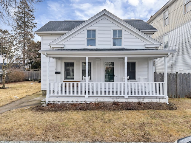 11 Pearl St, Groton, CT 06340 - view of front of house with a porch, a shingled roof, a front yard, and fence