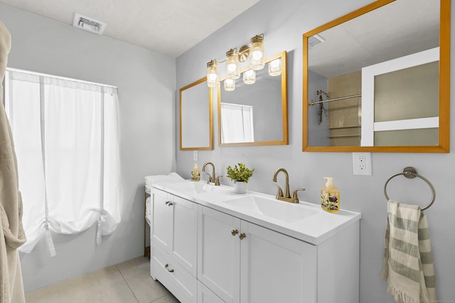 11 Pearl St, Groton, CT 06340 - bathroom with tile patterned floors, visible vents, double vanity, and a sink