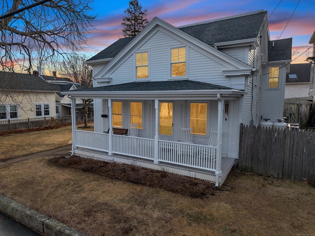 11 Pearl St, Groton, CT 06340 - view of front of house with covered porch, roof with shingles, and fence