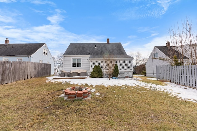 back of house with a patio, a shingled roof, a lawn, an outdoor fire pit, and a fenced backyard