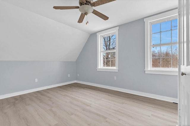 additional living space with light wood-style floors, plenty of natural light, and baseboards