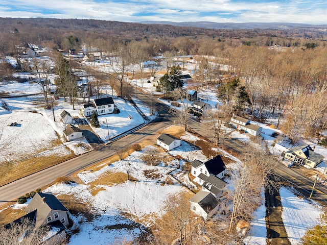 snowy aerial view with a residential view