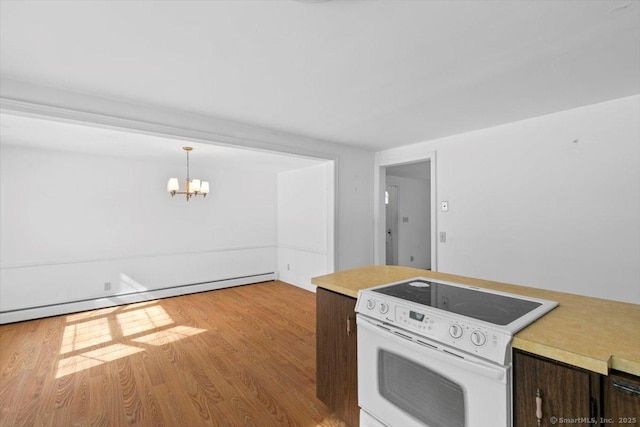 kitchen featuring a notable chandelier, light countertops, light wood-style flooring, electric range, and baseboard heating