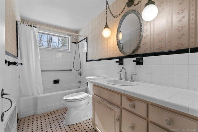 bathroom with toilet, wallpapered walls, radiator, and shower / bath combo