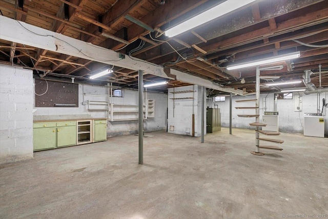 unfinished basement with independent washer and dryer