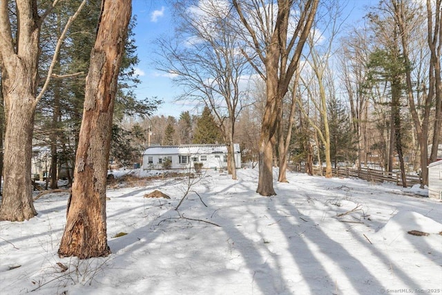 view of yard layered in snow