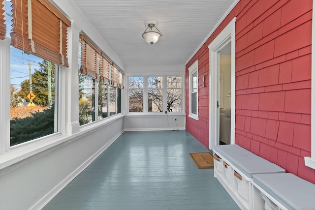 unfurnished sunroom with a wealth of natural light