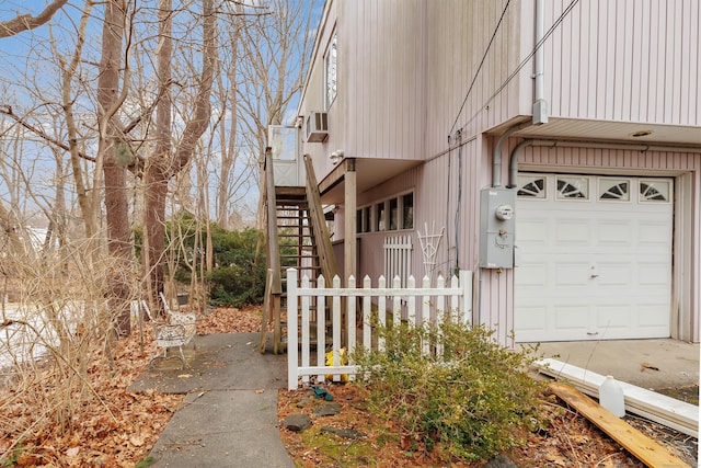 view of side of home featuring stairs