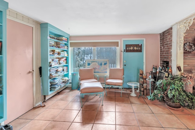 living area with tile patterned floors