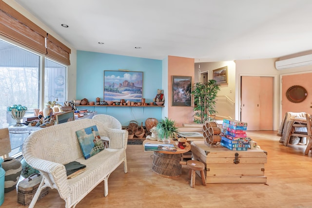 interior space with recessed lighting, an AC wall unit, and wood finished floors