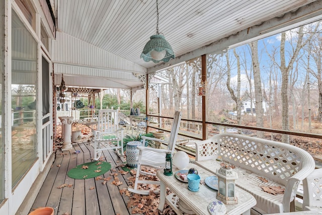 sunroom featuring lofted ceiling