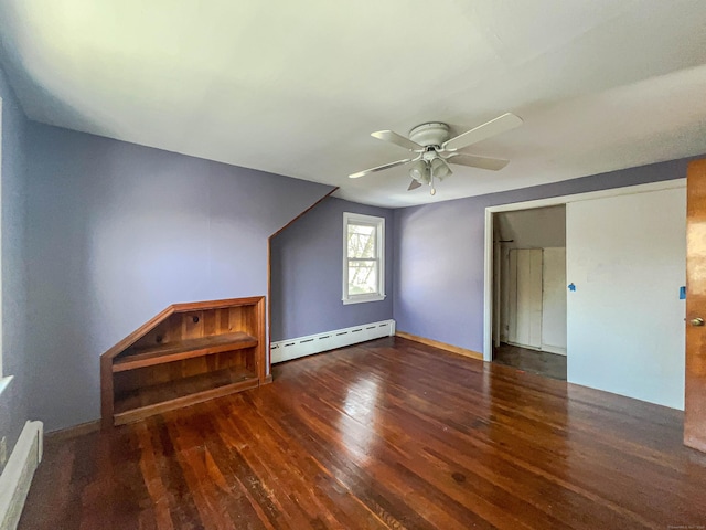 additional living space with baseboard heating, a baseboard radiator, wood finished floors, and a ceiling fan