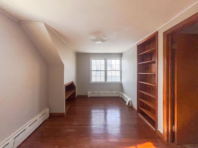 bonus room with a baseboard radiator, a baseboard heating unit, and wood finished floors