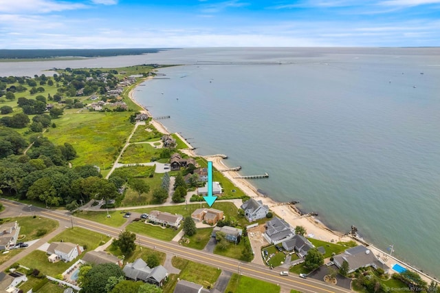 drone / aerial view with a water view and a residential view