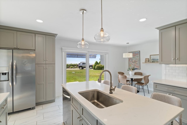 4 Old Fenwick Rd, Old Saybrook, CT 06475 - kitchen featuring appliances with stainless steel finishes, gray cabinetry, recessed lighting, hanging light fixtures, and light marble finish floors