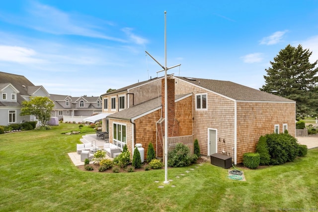 4 Old Fenwick Rd, Old Saybrook, CT 06475 - back of house featuring an outdoor hangout area, a patio, a yard, and a residential view