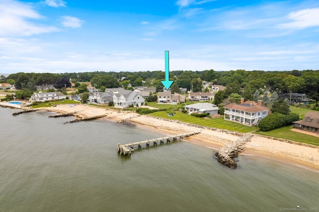 birds eye view of property featuring a water view and a residential view