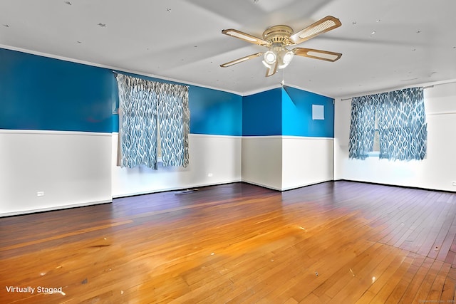 spare room featuring ornamental molding, ceiling fan, and hardwood / wood-style flooring