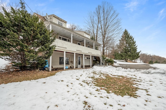 snow covered house with a garage