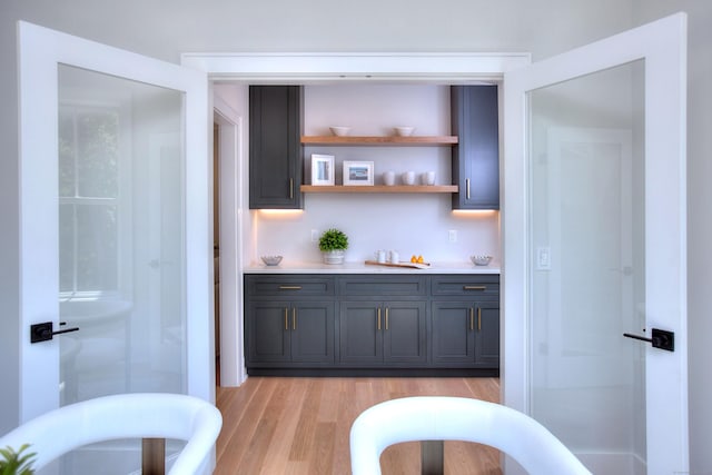 bar featuring light wood-style floors