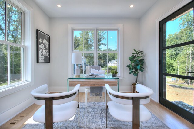 interior space with wood finished floors, visible vents, and recessed lighting