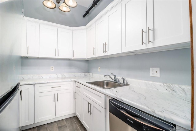 kitchen featuring white cabinets, a sink, and stainless steel dishwasher