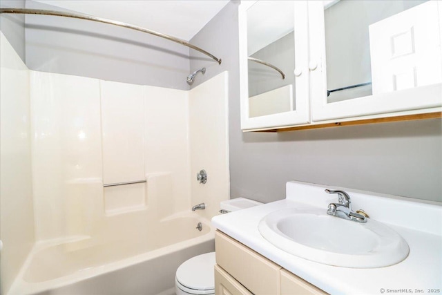 bathroom featuring toilet, shower / bath combination, and vanity