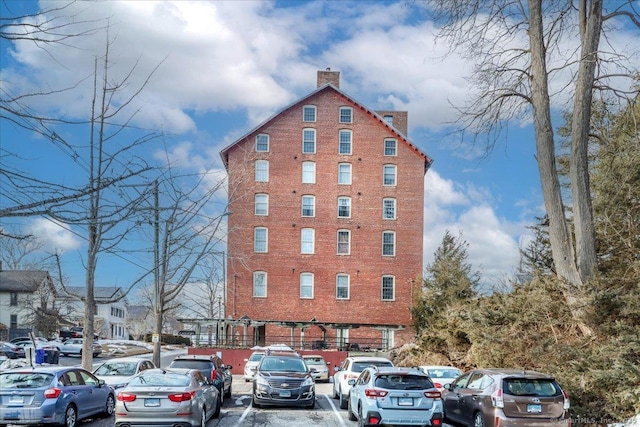 view of property featuring uncovered parking