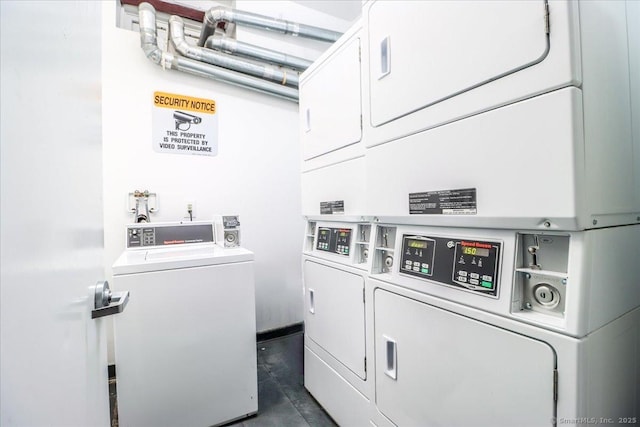 shared laundry area featuring stacked washer and dryer and washing machine and dryer