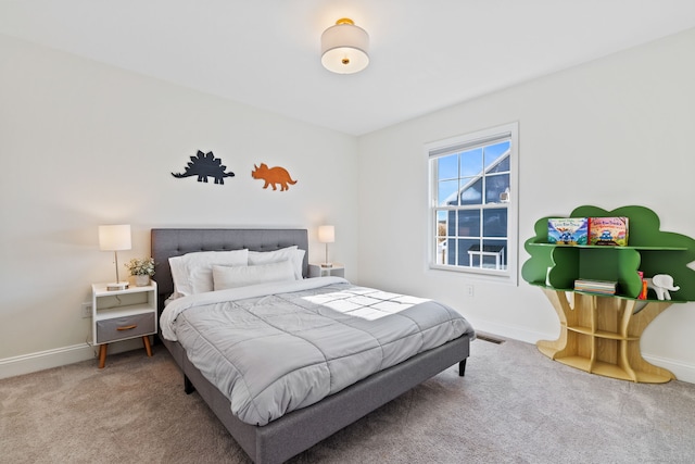 bedroom featuring carpet floors, visible vents, and baseboards